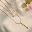 Elegant Gold-Tone Layered Necklace with Crystal Pendant & Long Bar Charm
